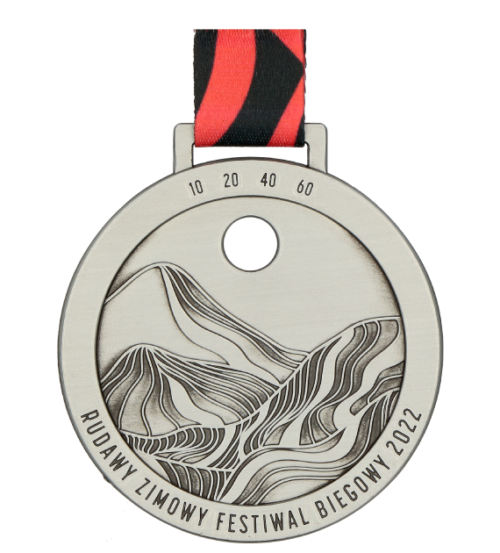 Medal na Rudawy Zimowy Festiwal Biegowy to medal odlewany nawiązujący do symboliki wydarzenia - przód