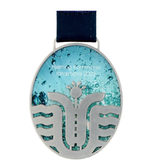 Nagroda rekreacyjno - sportowa to medal LaserCut stworzony z połączenia dwóch paneli metalowych wyciętych w charakterystyczny, owalny kształt - przód