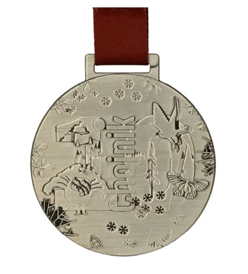 Medal na Chojnik Karkonoski Festiwal Biegowy o okrągłym kształcie z licznymi zdobieniami - przód