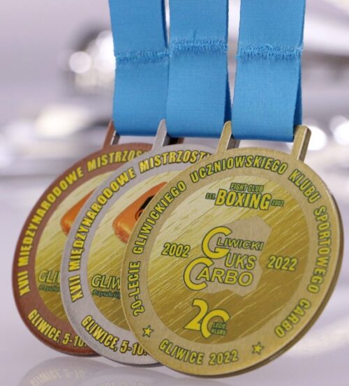 Medal na Międzynarodowe Mistrzostwa Śląska Kobiet w Boksie ma okrągły kształt oraz kolorowy nadruk