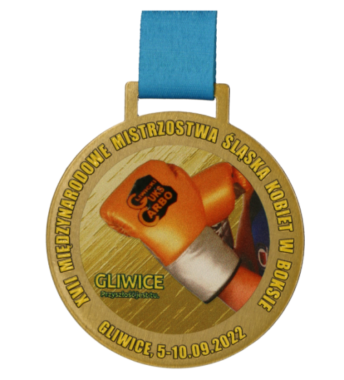 Medal na Międzynarodowe Mistrzostwa Śląska Kobiet w Boksie ma okrągły kształt oraz kolorowy nadruk - przód